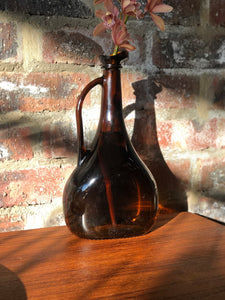 Dark amber glass jug