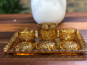 Amber glass vanity set in tray