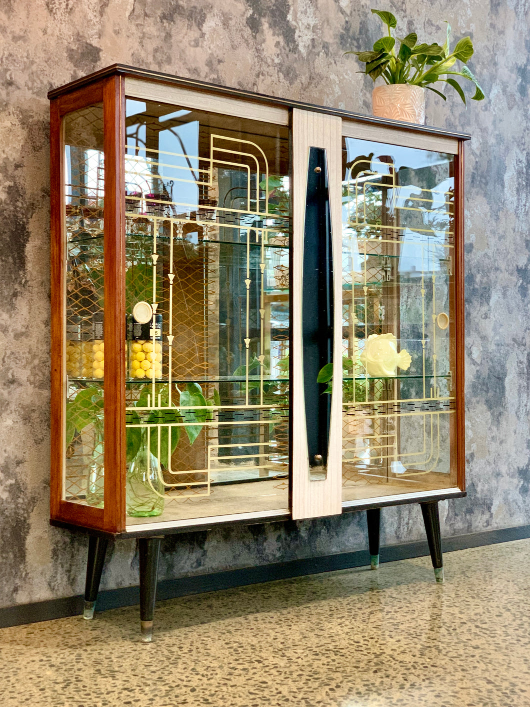 vintage drinks cabinet with printed glass panels