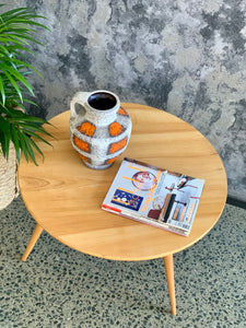 Low round wooden coffee table