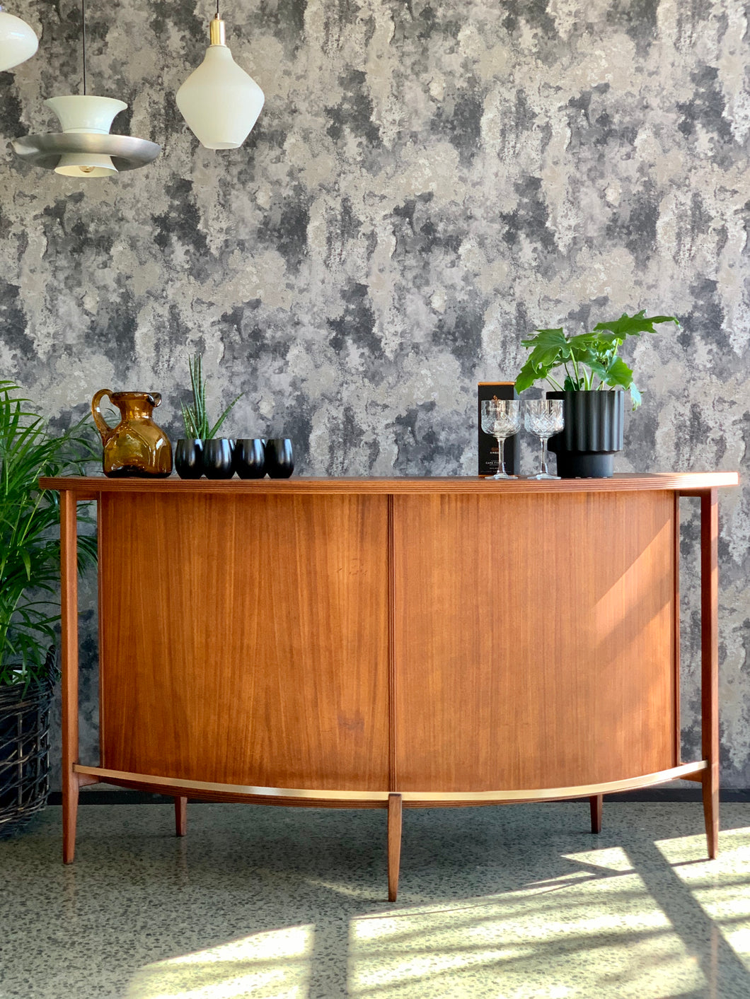 Mid-Century curved bar with brass foot rest