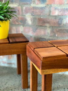 A pair of cubist side tables