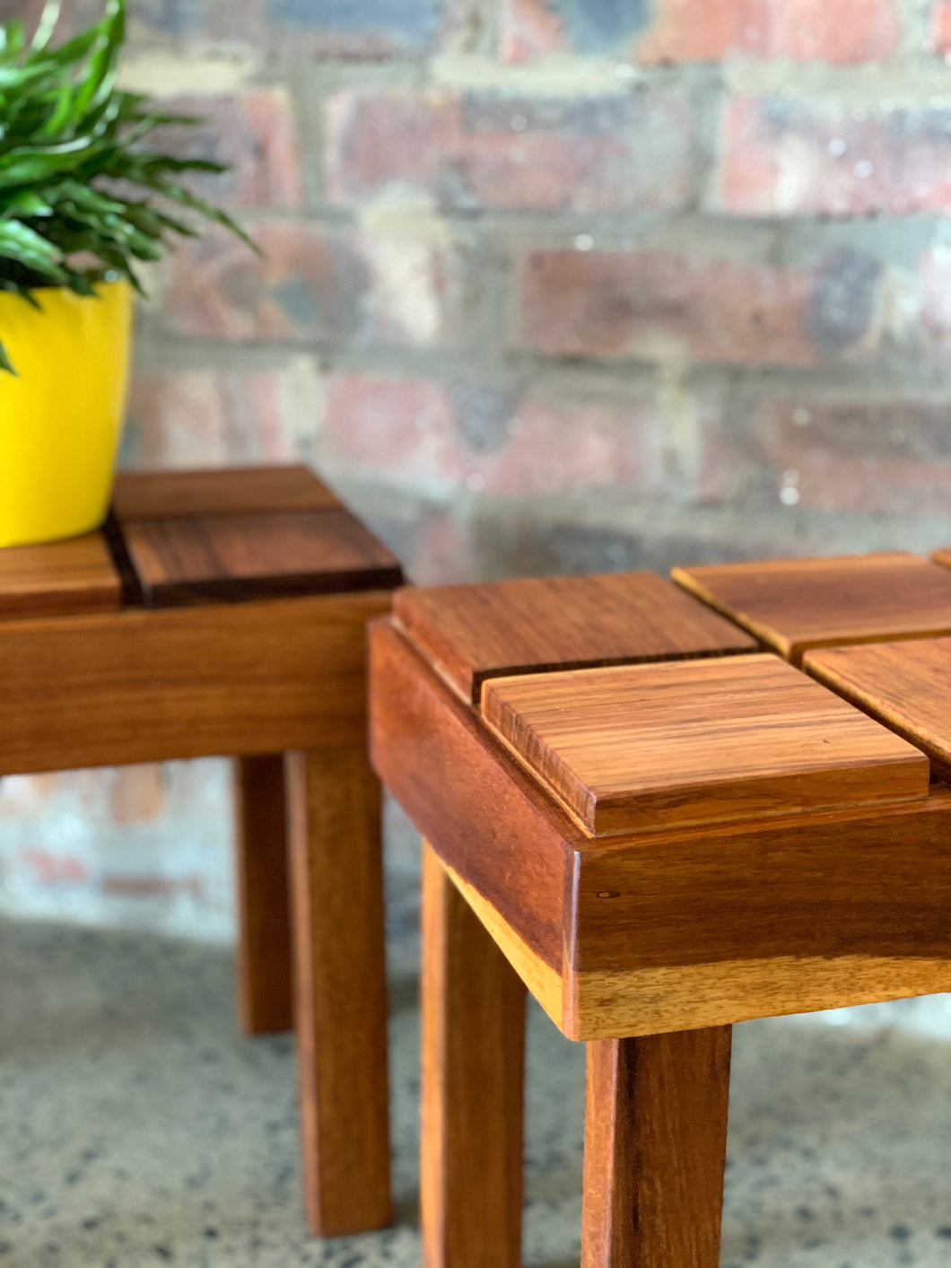 A pair of cubist side tables